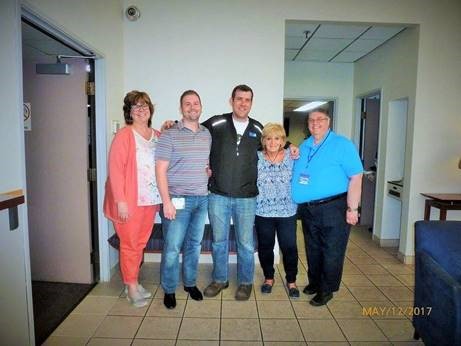 A picture of Paul Avery from 2017 with coworkers. He is on the far right, and to his left, in order, is Susan Dysarczyk, Marcus Carbajo, Brett Ouellette, and Maryann Underhill.