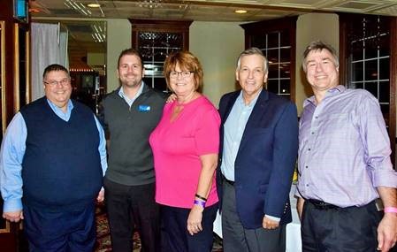 A picture of Paul Avery with the other company officers at Trans-Overseas taken at an event. Paul is on the far left, and then next to him moving right is Brett Ouellette, Maryann Underhill, Tom Ward, and Joe Kamykowski.